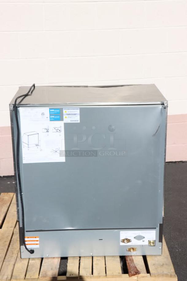 Brand new Manitowoc UDF0310A ice machine, 30" air-cooled, 286 lb. capacity. Features include a 119 lb. bin; visible scratch. Tags display model info.