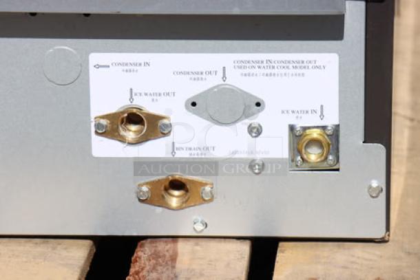Manitowoc UDF0310A ice machine connections panel, showing water input/output and drain ports, brand new condition.