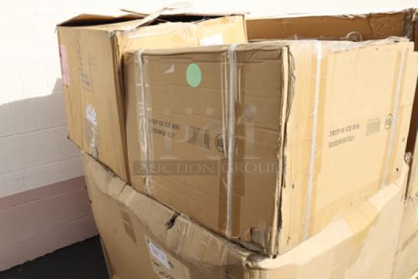 Cardboard boxes containing Delfield 240 Drop-In Stainless Steel Ice Chest and Regency DIWSIBF-182113 Water Station with Ice Bin.