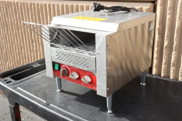 Avantco T3300B Conveyor Toaster, 10" wide, 3" opening, 208V, scratches, red controls, serial 4528023184T3300B, on black surface.