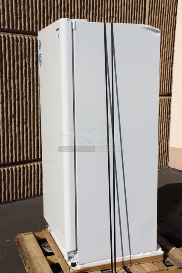 Danby DUF167A5WDD 16.7 cu. ft. white reach-in freezer, brand new with scratches, solid door, working order, on pallet.