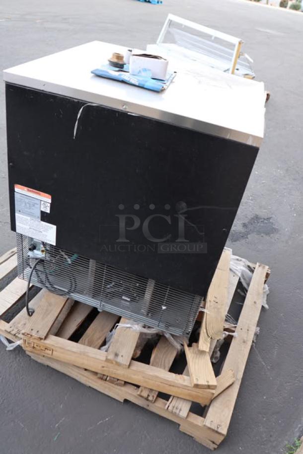 Manitowoc UNP0300A-161 air-cooled nugget ice machine, 50 lb. bin, 325 lb. capacity, scratch and dent condition, visible tags.