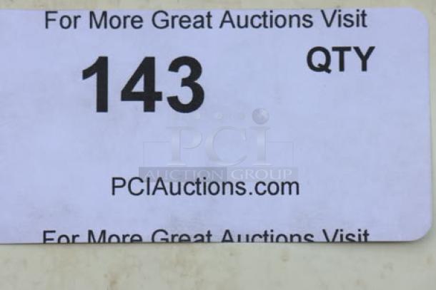 Label on a Manitowoc UNP0300A-161 undercounter ice machine, displaying auction details, number 143, and the website PCIauctions.com.