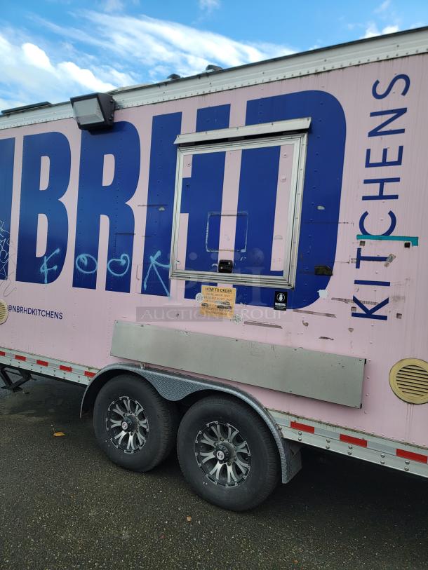 2021 16' REEF/NBRHD mobile kitchen trailer exterior, pink and blue, dual axle, ventilation, ordering window, minor wear.