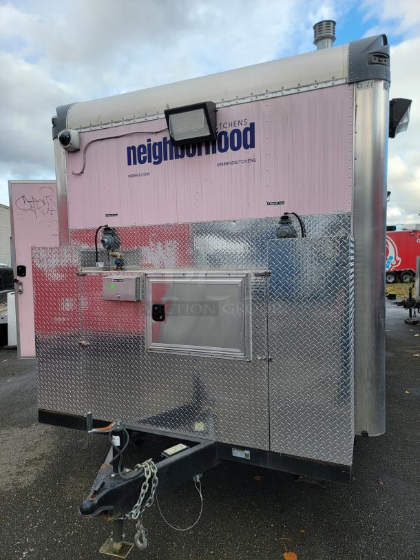 2021 Quality 16' mobile kitchen trailer, pink and silver, with diamond-plate flooring, security cameras, and "neighborhood" branding.