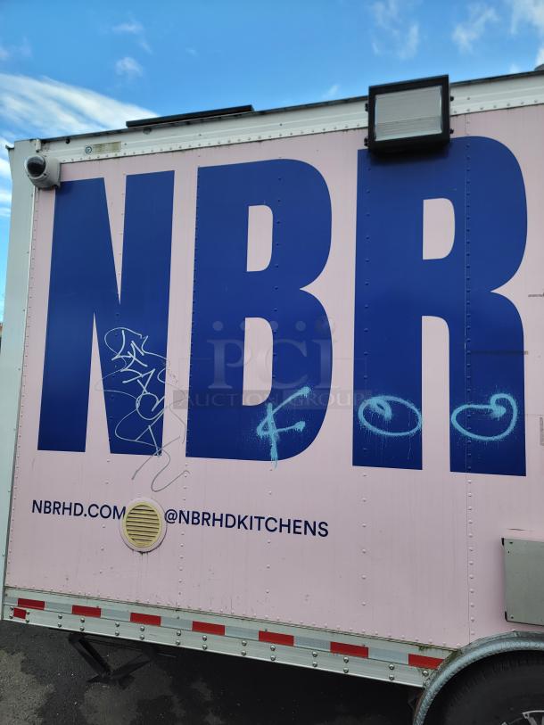 2021 16' REEF/NBRHD mobile kitchen trailer with graffiti, exterior security camera, and NBRHD branding visible.