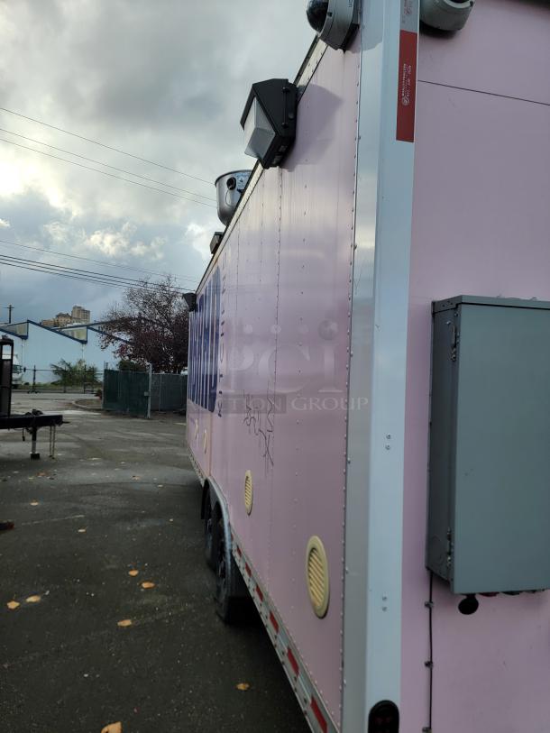 2021 16' Quality mobile kitchen trailer, pink exterior, security cameras, exterior lighting, for high-volume food service.