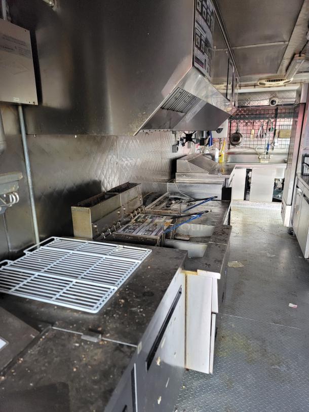 2021 16' mobile kitchen trailer with Arctic Air units, exhaust hood, diamond-plate flooring, sinks, and storage space.