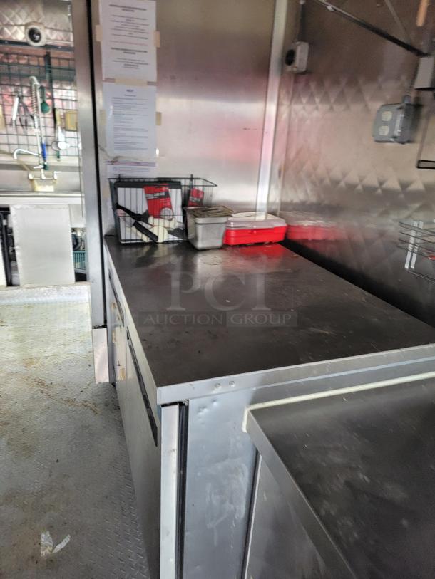 2021 16' Quality mobile kitchen trailer interior with diamond-plate flooring, Arctic Air units, sinks, and storage.