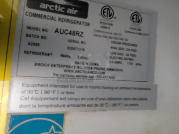 Arctic Air commercial refrigerator label showing model AUC48RZ, batch A3898, refrigerant R290, and usage guidelines.