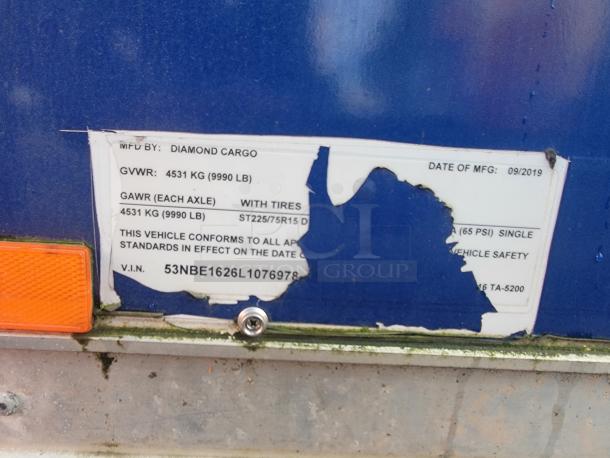 2019 Diamond Cargo 16' food trailer label, partially damaged; visible details include MFG: Diamond Cargo, GVWR: 4531 kg, VIN: 53NBE1626L1076978.