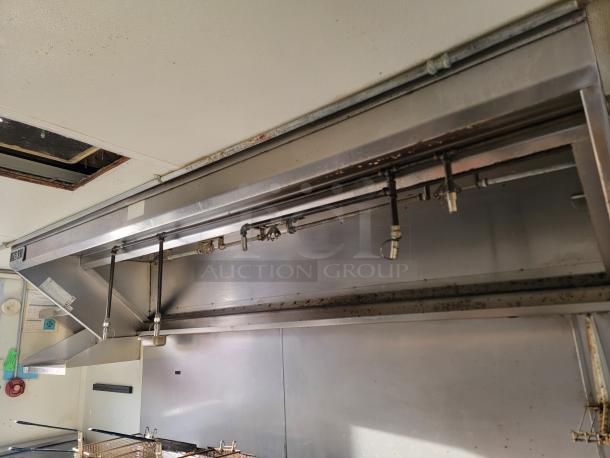 2019 Diamond Cargo 16' ghost kitchen trailer interior, featuring stainless steel vent hood with fire suppression system.