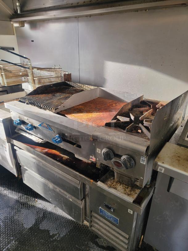 2019 Diamond Cargo 16' food trailer interior with stainless steel cook line, griddle, fryer, gas range, and refrigeration units.