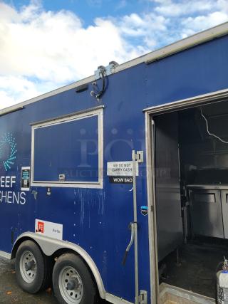 2019 Diamond Cargo 16' food trailer, blue exterior, tandem-axle, side service window, open door showing interior kitchen equipment.
