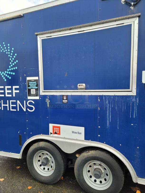 2019 Diamond Cargo 16' food trailer, blue exterior, tandem-axle, with exterior service window and branding.