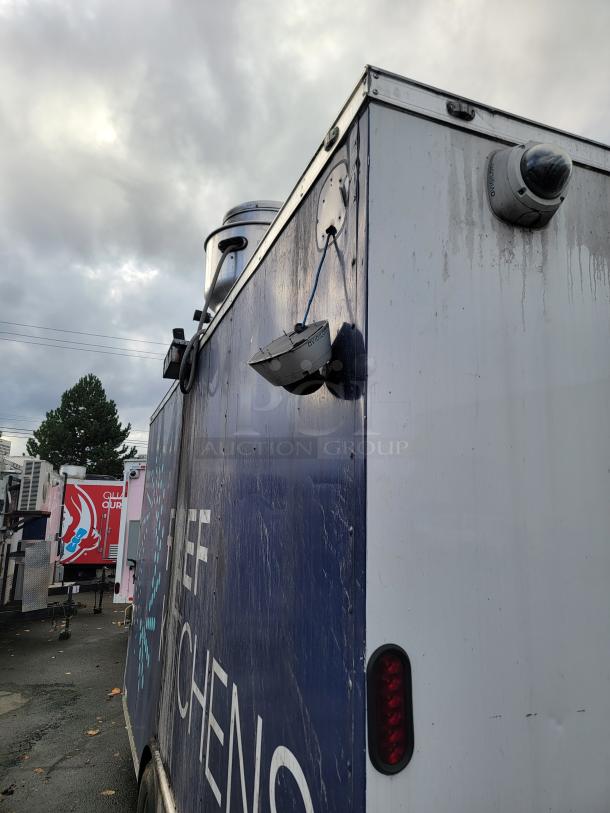 2019 Diamond Cargo 16' food trailer with exterior security cameras, visible signs of wear. Features include tandem axles.