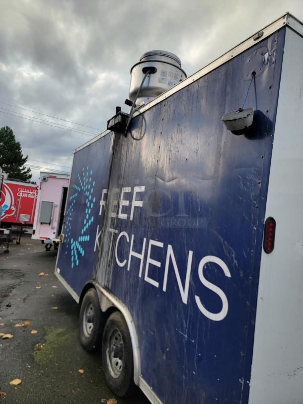 2019 Diamond Cargo 16' food trailer, blue exterior with "REEF KITCHENS" logo, mounted equipment visible.