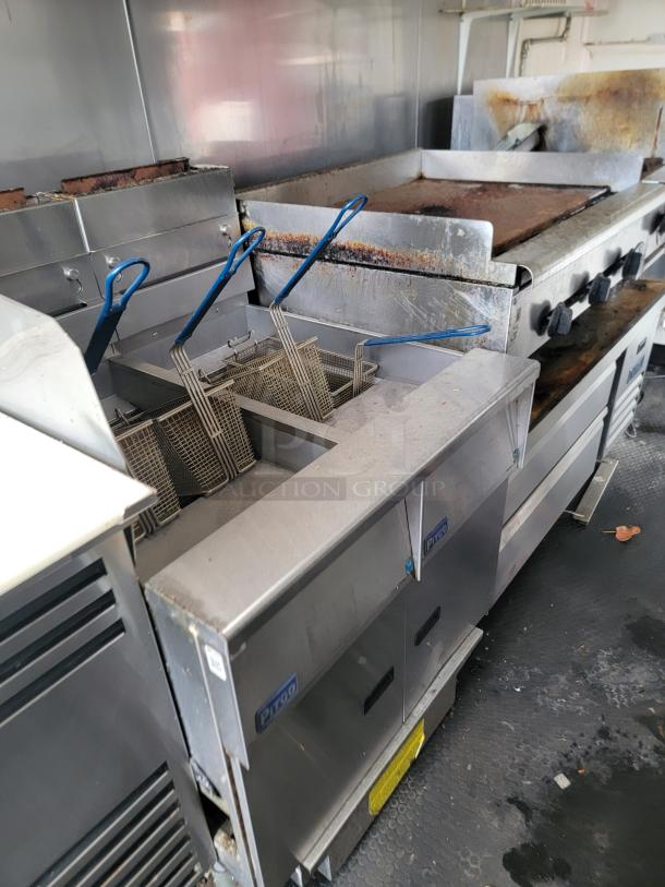 2019 Diamond Cargo 16' food trailer with Pitco fryer, Wells griddle, under commercial exhaust, and True refrigeration.