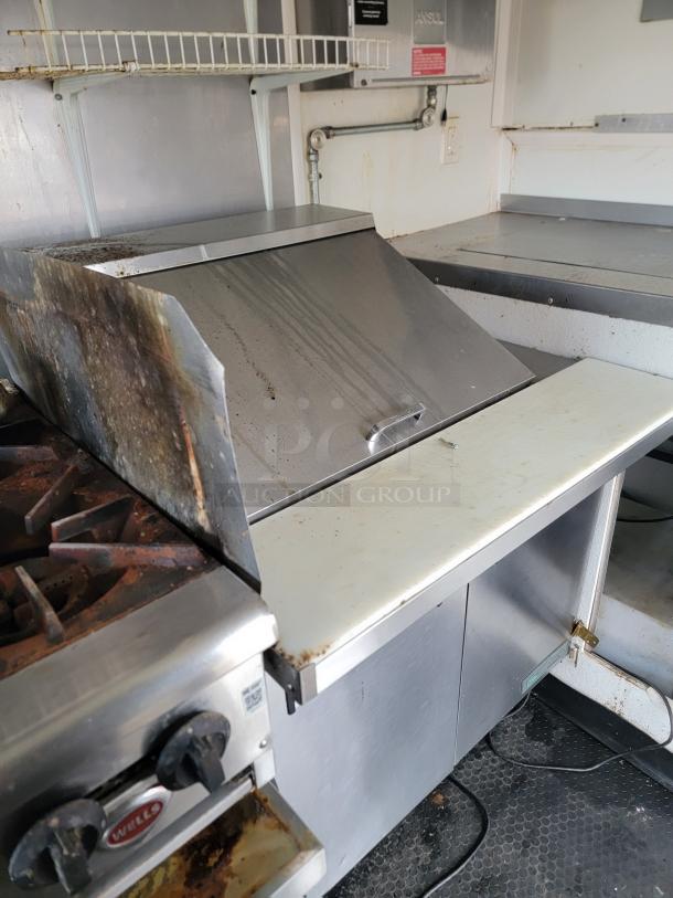 2019 Diamond Cargo 16' turnkey food trailer interior showing Wells griddle, Pitco fryer, ANSUL system, and prep area.