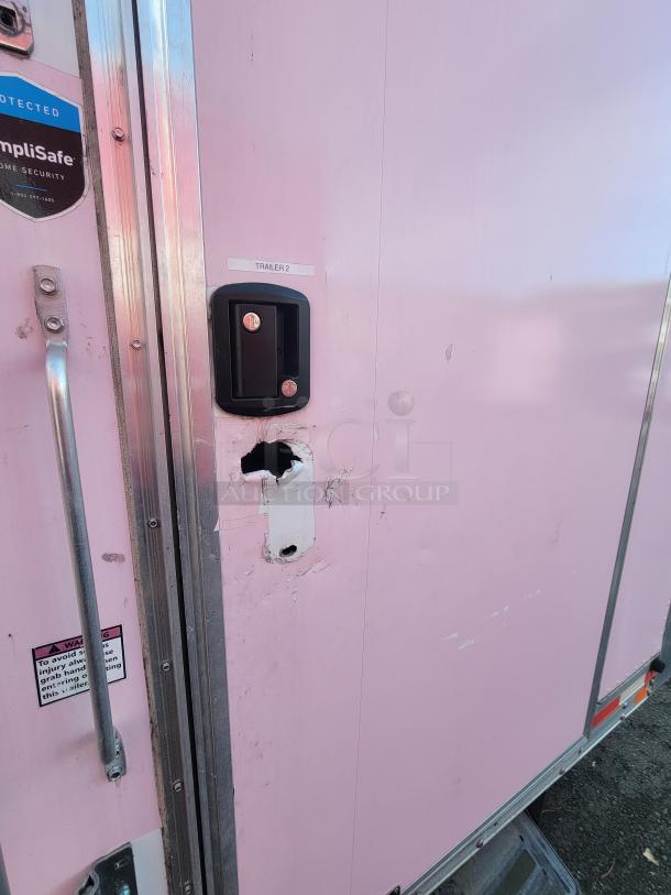 2020 Diamond Cargo 16' food trailer with visible handle and lock, labeled "TRAILER 2"; minor exterior wear.