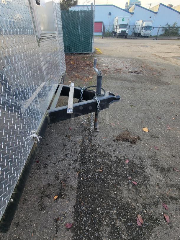 2020 Diamond Cargo 16' food trailer hitch and diamond-plate exterior. Well-maintained, ready for commercial use.