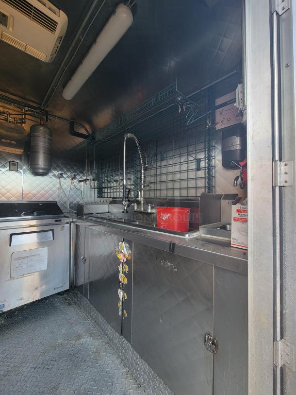 2020 Quality 16' mobile kitchen with stainless steel interior, 3-compartment sink, and diamond-plate flooring.