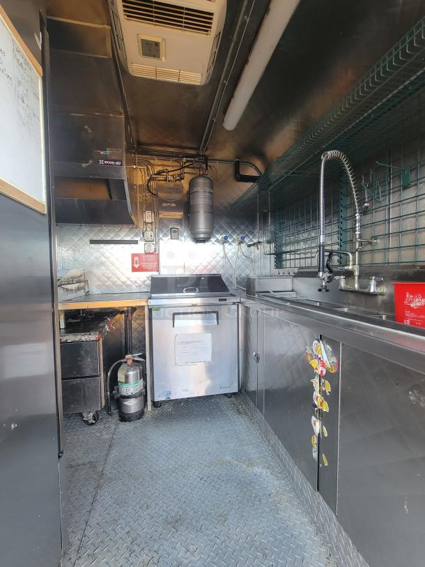 2020 16' Quality mobile kitchen trailer; features Pitco fryer, Turbo air refrigeration, stainless steel, and diamond-plate floor.