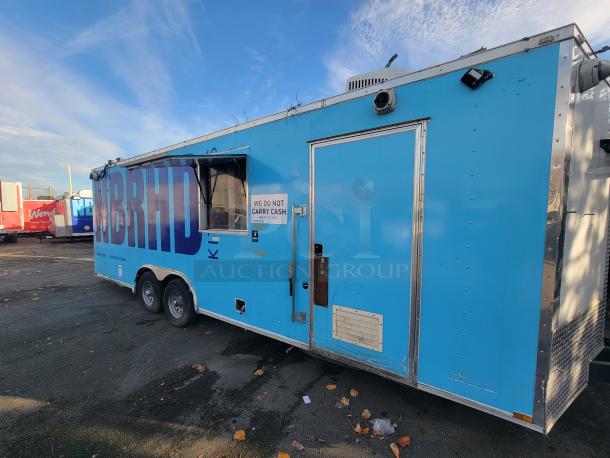 2019 Quality 24' food trailer in blue, equipped with fryers, griddle, and refrigeration units. “WE DO NOT CARRY CASH” sign visible.