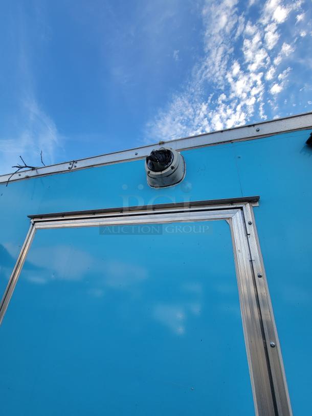 Blue exterior of a 2019 Quality 24-foot food truck with visible vent and metal trim.