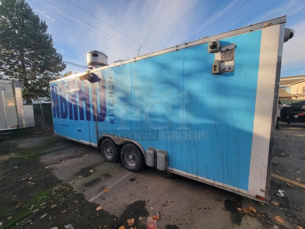 2019 Quality 24' food trailer with dual axles, exterior "Kitchens" signage, and roof vent. Ready-to-use mobile kitchen.