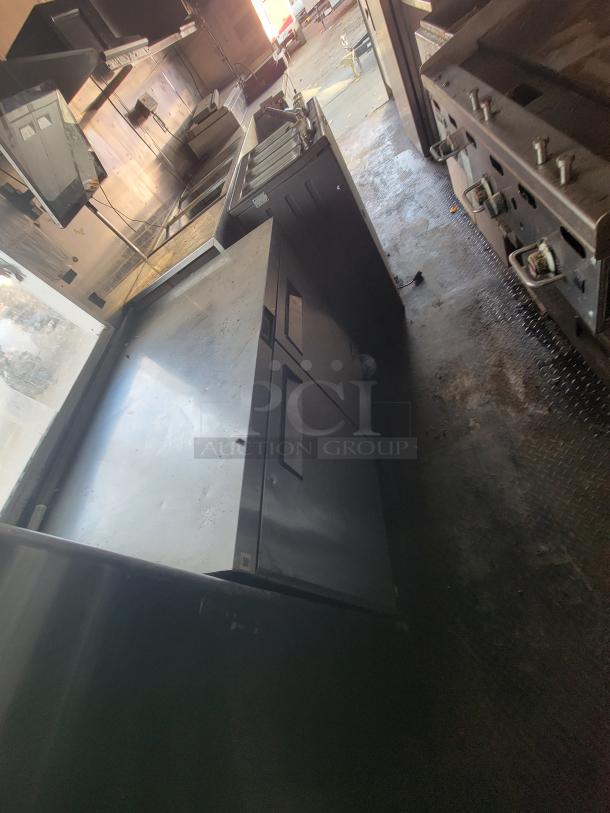 2019 Quality 24' food trailer interior with stainless steel prep tables, Royal Range fryers, and griddle. Used condition.