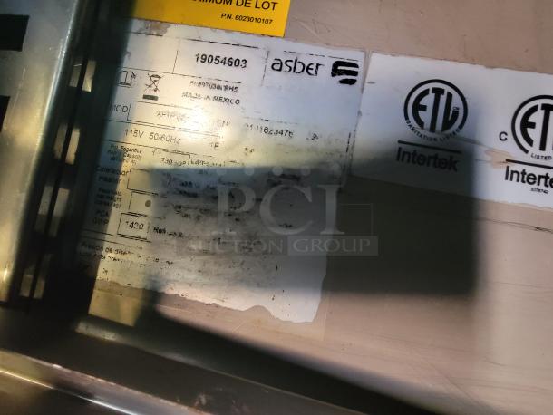 Label inside a food trailer showing appliance details. Brand: Asber, Model: APTS-27-8. ETL certified by Intertek.