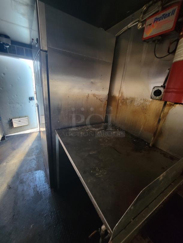 2019 Quality 24' food trailer interior, featuring a stainless steel work area and visible ProTex II system.