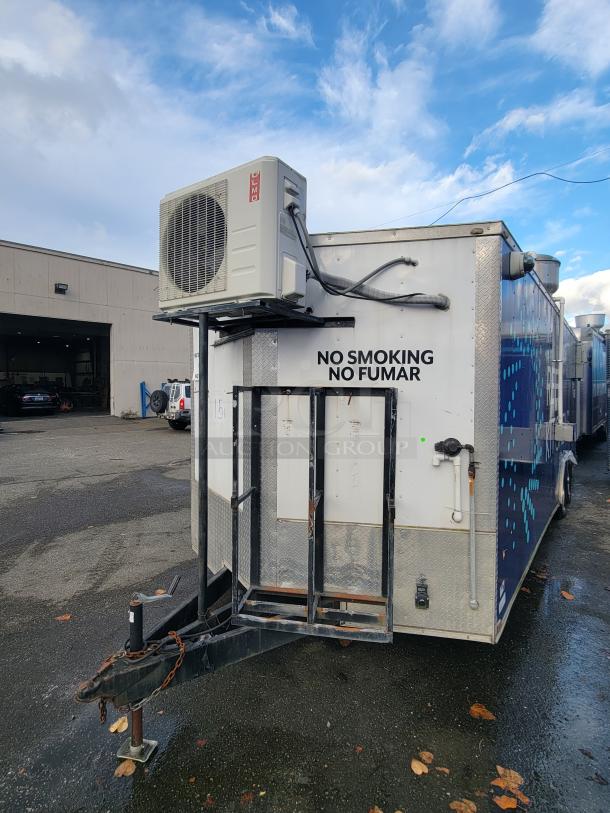 2019 24' Quality commercial food trailer, with mounted air conditioning unit, "No Smoking" sign. Equipped for food service.