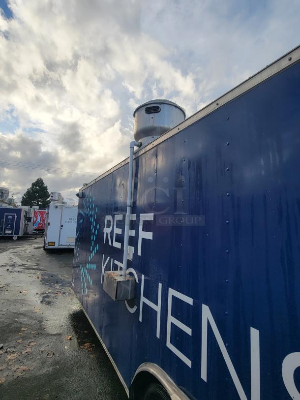2019 Quality 24' commercial food trailer, blue exterior with "REEF Kitchens" logo, vent hood visible.