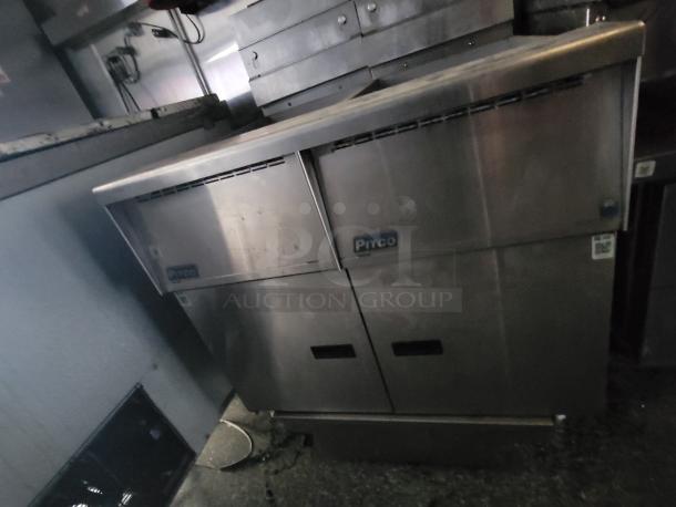 2019 Quality 24' food trailer interior showing a Pitco deep fryer, stainless steel finish, commercial-grade setup.