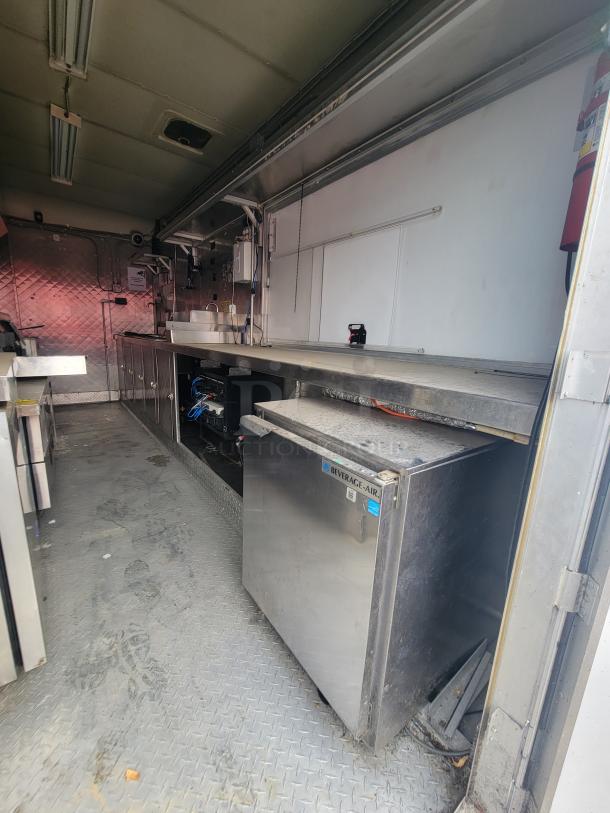 2018 "NBRHD Kitchens" 16' food trailer, fully equipped. Features commercial appliances, Beverage-Air fridge, steel interior.