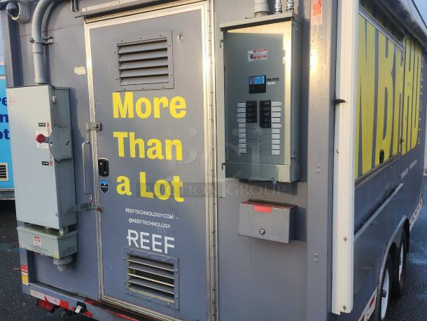 2018 16' NBRHD Kitchens food trailer, gray exterior with "More Than a Lot" text, REEF Technology branding, utility boxes.
