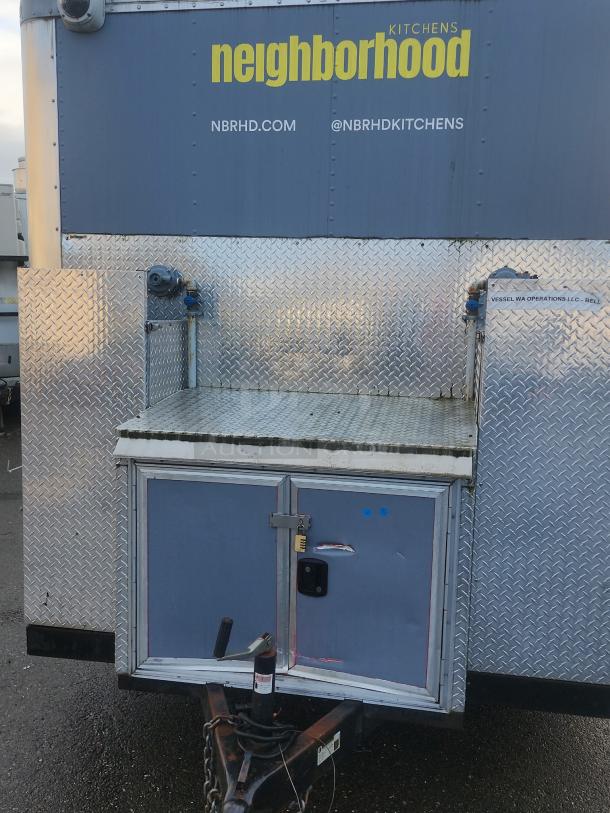 2018 16' NBRHD Kitchens food trailer, diamond plate exterior, sturdy utility hook-ups, logo and contact info visible.