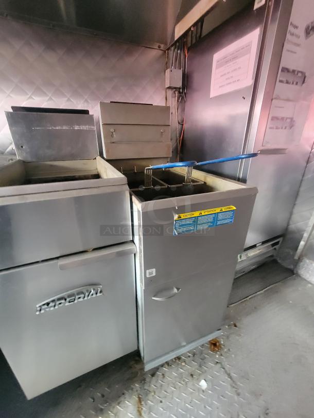 2018 NBRHD Kitchens food trailer interior with commercial-grade Imperial fryer; well-maintained stainless steel appliances.