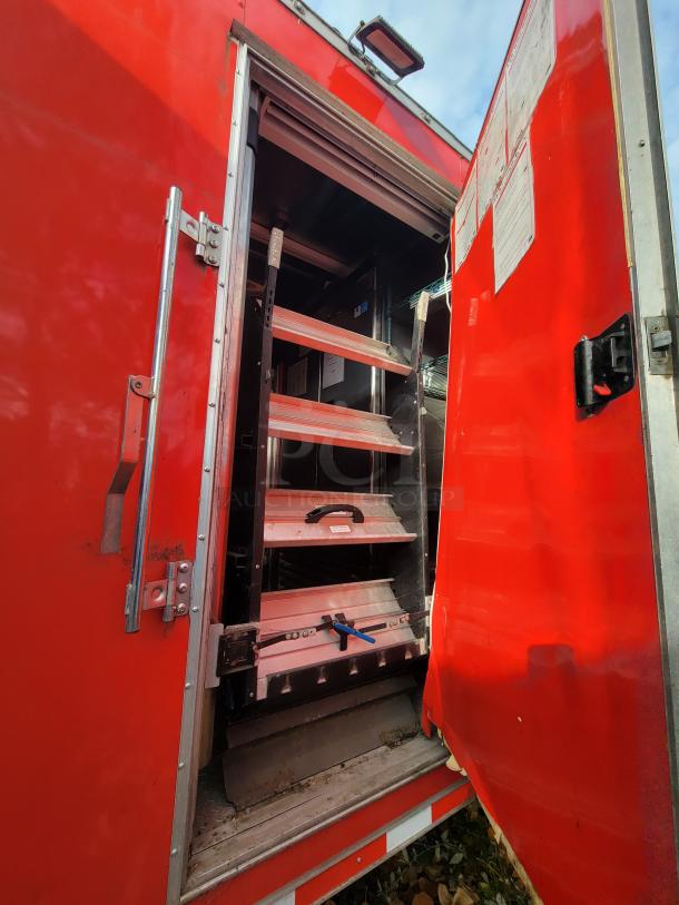Red 2021 Wendy's Ghost Kitchen Trailer, open side door revealing interior storage shelves. Ideal for high-volume food delivery.