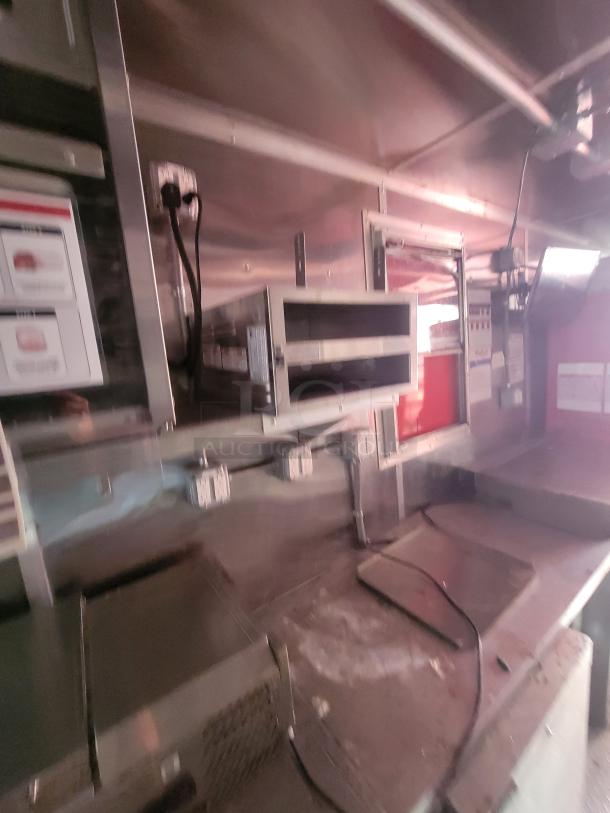 2021 28' Wendy's mobile ghost kitchen interior, fully equipped with commercial appliances in a high-end custom trailer.