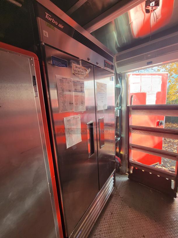 2021 Wendy's mobile ghost kitchen interior, featuring Turbo Air commercial refrigerator with visible inventory lists attached.