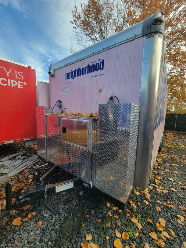 2021 Quality Kitchens 24' mobile food trailer with dual-axle, equipped for ghost kitchen use, includes Imperial fryers, gas griddle, Econ-Air exhaust, Arctic Air refrigeration, stainless steel interior, and sanitation system.
