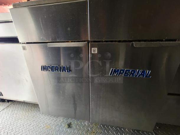 2021 Quality Kitchen mobile food trailer with Imperial deep fryers, stainless steel interior, and dual-axle design.