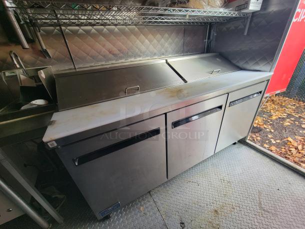 2021 24' Quality Kitchens mobile food trailer interior showing Arctic Air refrigeration and prep area in stainless steel.