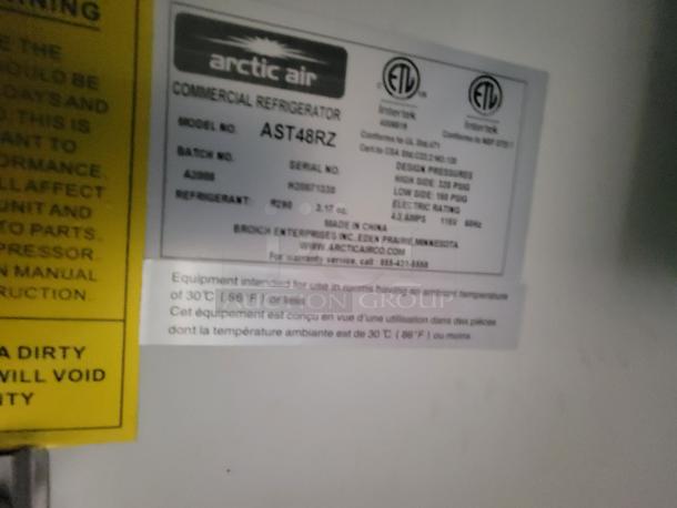 Arctic Air commercial refrigerator model AST48RZ label with technical specs, including refrigerant type R290 and electrical details.