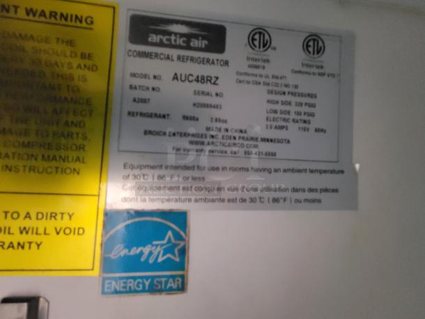 Label on Arctic Air commercial refrigerator model AUC48R, with energy efficiency and ETL certifications displayed.