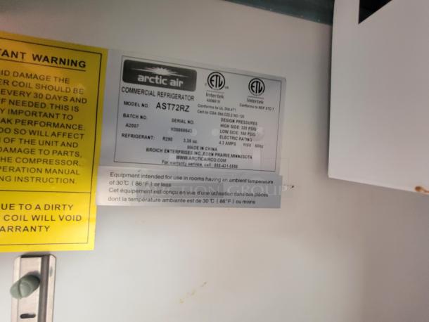 Arctic Air commercial refrigerator label, model AST72R2, with specifications and warranty details.