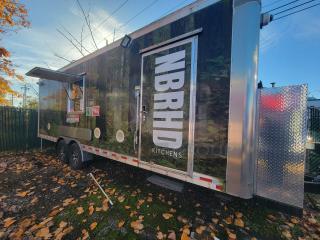 2021 24' Quality Food Trailer, stainless steel, equipped with Econ-Air hood, Arctic Air units, and surveillance cameras.